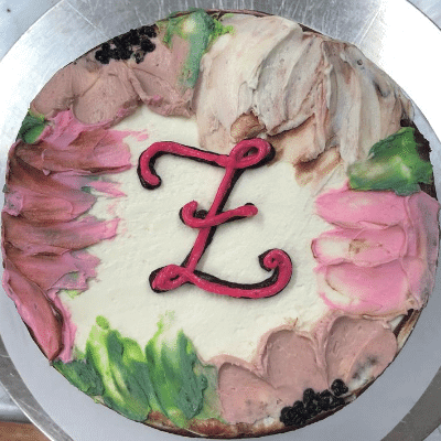 Monogrammed Birthday Cake for women covered in buttercream flowers