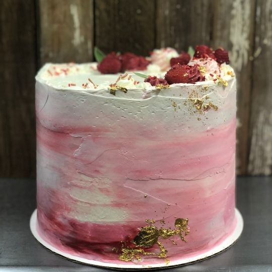 Raspberry cake with gold foil for bridal shower