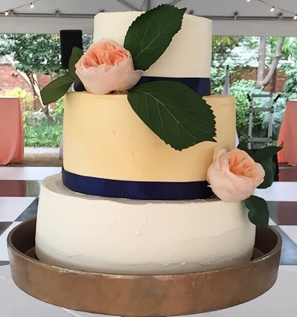 Simple, unique wedding cake dotted with peonies
