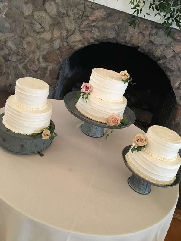 3 elegant wedding cakes with roses