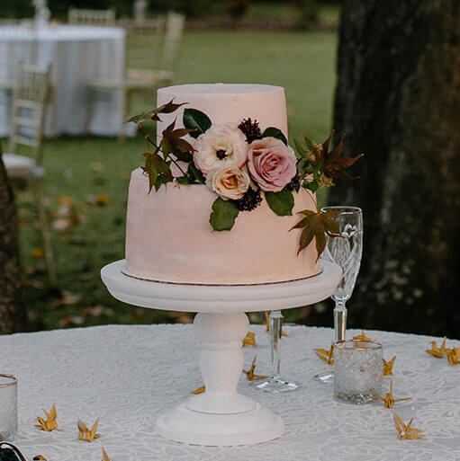 2 tier pink wedding cake with flowers