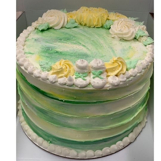 Green and yellow gender neutral baby shower cake