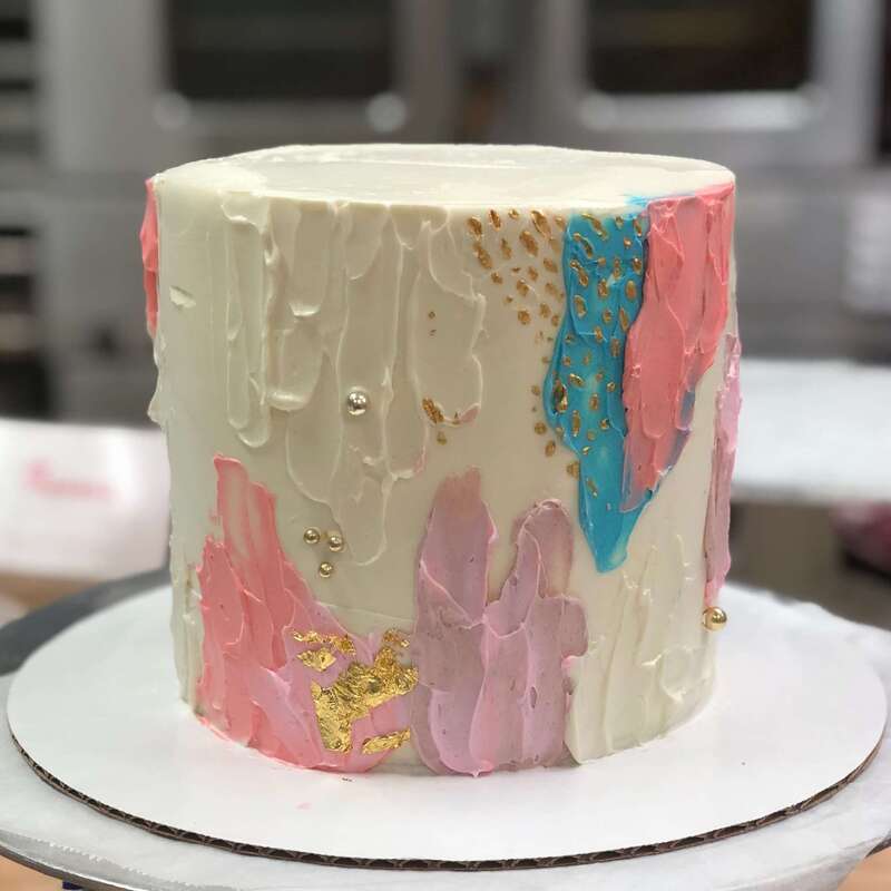 Colorful custom birthday cake with gold leaf