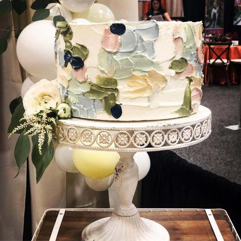 1 tier wedding cake covered in hand-painted buttercream flowers