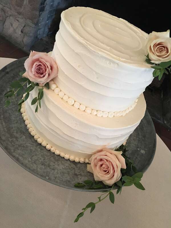 Wedding cake simply decorated with rippled icing
