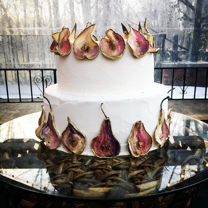 unique wedding cake lined with gold leaf pears