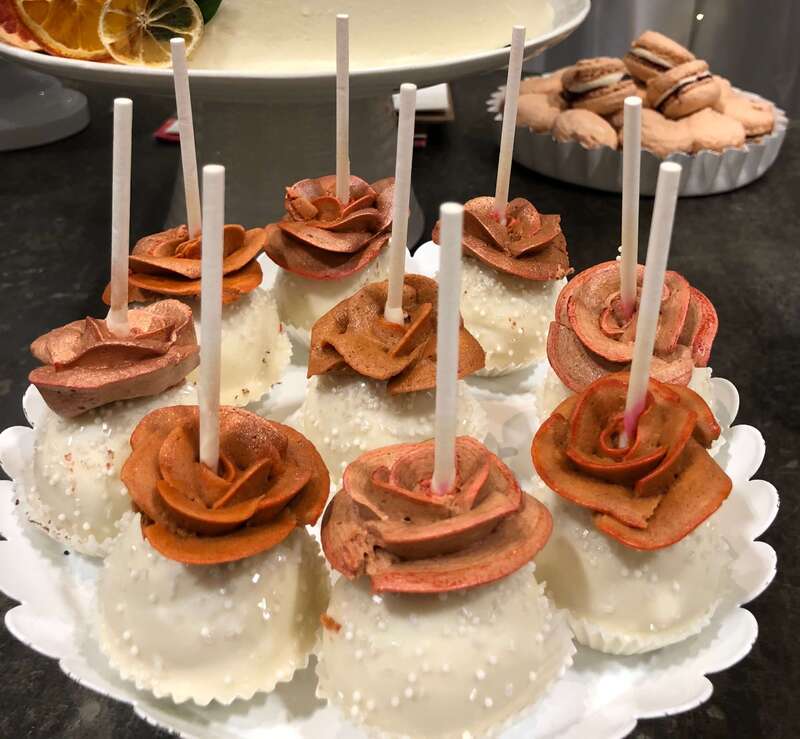 Wedding cake pops decorated with rose petals